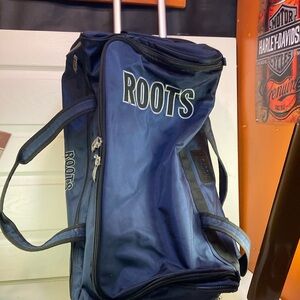 Roots luggage travel bag with wheels